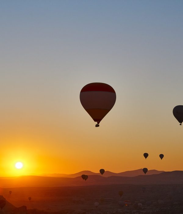 Balloons at dusk in Cappadocia. Spectacular flight in Goreme. Turkey