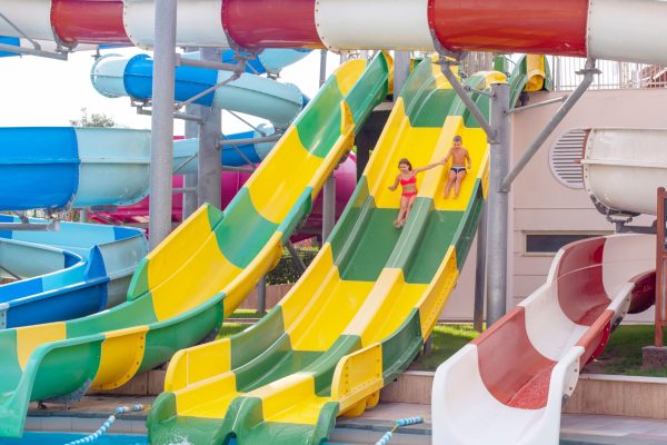 boy-and-girl-ride-with-a-water-slide-in-the-water-2026-01-11-08-49-15-utc