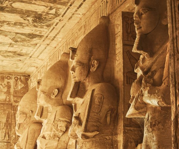 Sculptures from The Great Temple of Ramesses II in Abu Simbel. Osiris pillars in the Hypostyle Hall of the Great Temple of Ramesses II. Popular Egyptian landmarks. Ancient Egypt. Vacation destination. Historic site